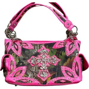 Hot pink camouflage, cross, rhinestone, and studded purse.